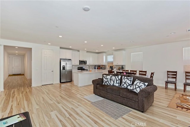 living room with light hardwood / wood-style floors