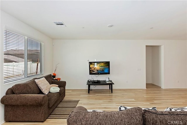 living room with light hardwood / wood-style flooring