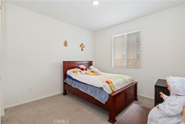 bedroom featuring light carpet