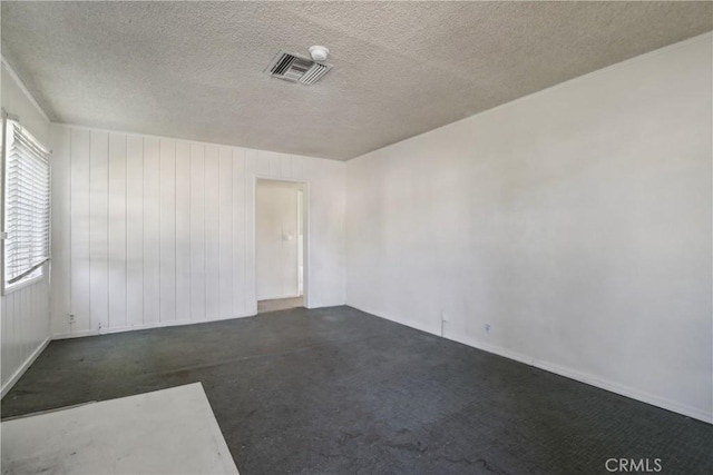 spare room featuring a textured ceiling