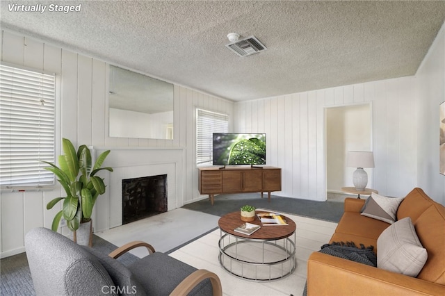 living room featuring a textured ceiling