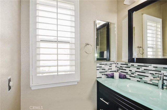 bathroom with vanity and backsplash