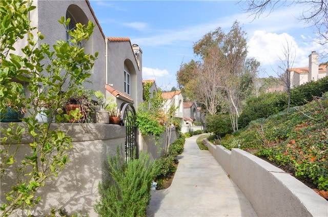 exterior space featuring a fenced front yard and a residential view