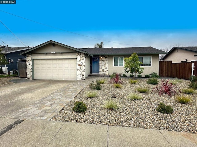 ranch-style house featuring a garage