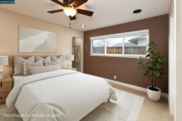 bedroom with light carpet and ceiling fan