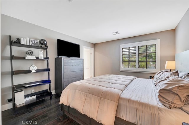 bedroom featuring dark hardwood / wood-style floors