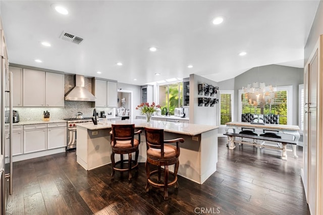 22544 N Summit Ridge Cir, Chatsworth, CA 91311 - kitchen featuring wall chimney range hood, high end stainless steel range, a kitchen island, light stone countertops, and recessed lighting