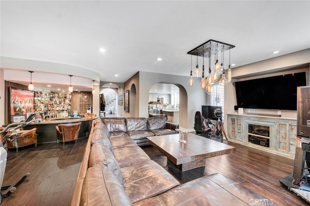22544 N Summit Ridge Cir, Chatsworth, CA 91311 - living area with arched walkways, hardwood / wood-style floors, recessed lighting, and a fireplace