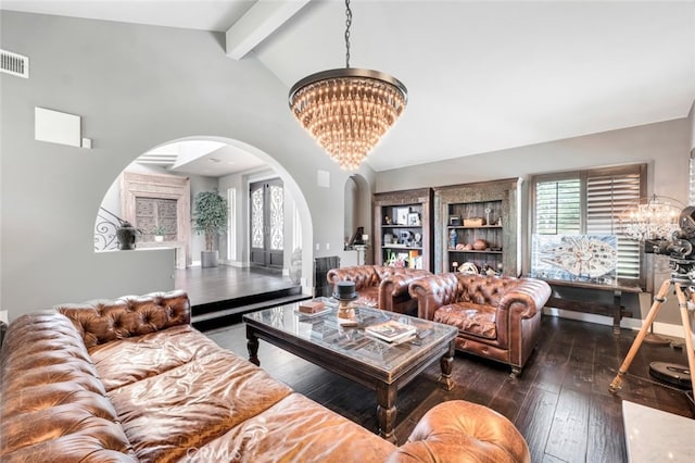 living room with a notable chandelier, beam ceiling, dark wood-type flooring, and a healthy amount of sunlight