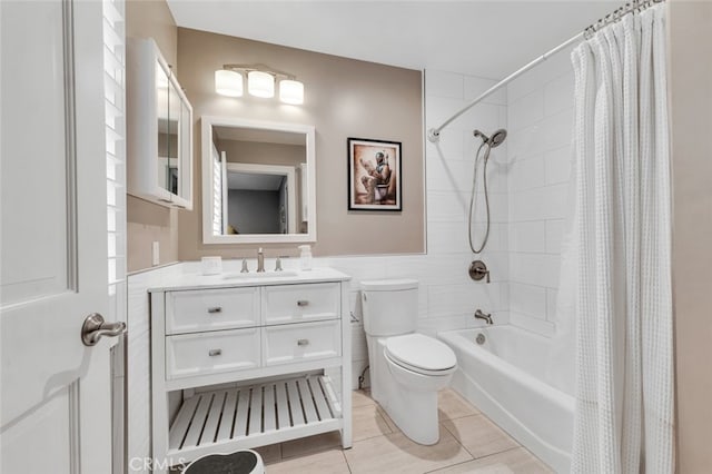 22544 N Summit Ridge Cir, Chatsworth, CA 91311 - full bath with vanity, shower / bathtub combination with curtain, tile walls, wainscoting, and tile patterned flooring
