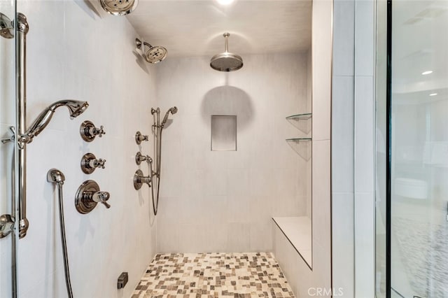 bathroom featuring tiled shower