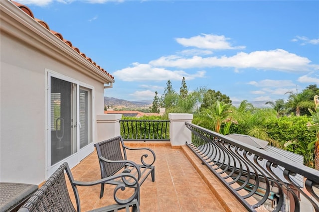 balcony featuring a mountain view