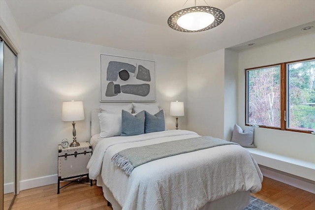 bedroom featuring hardwood / wood-style flooring and a closet