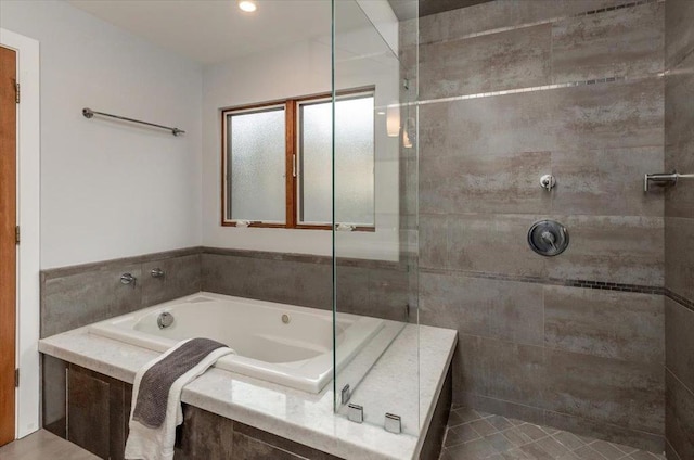 bathroom featuring plus walk in shower