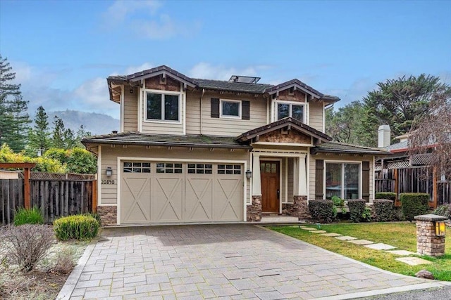 craftsman inspired home with a garage