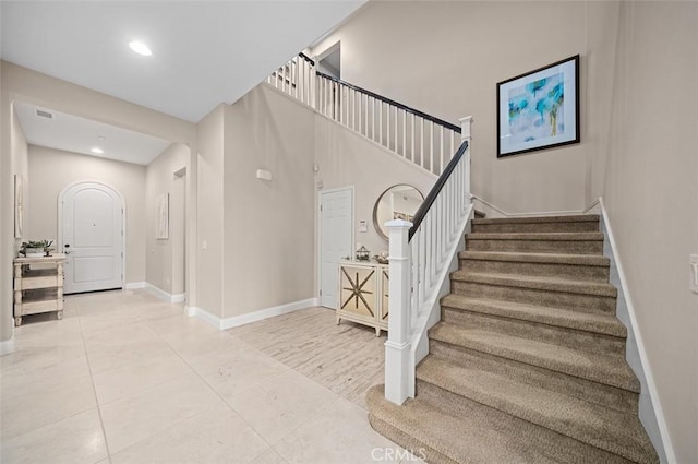 stairway featuring tile patterned floors