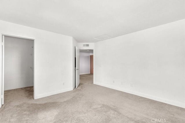 empty room with light colored carpet