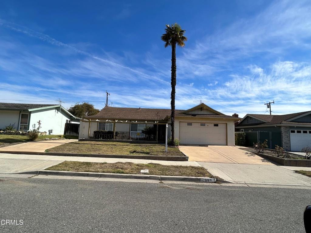 ranch-style house featuring a garage