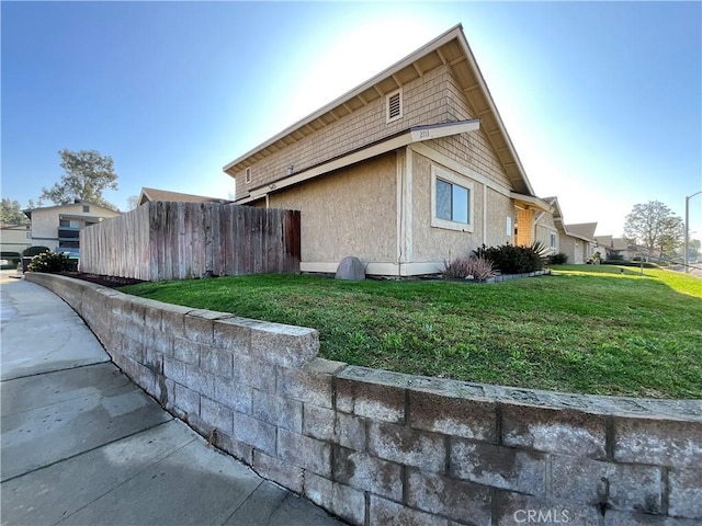 view of property exterior featuring a yard