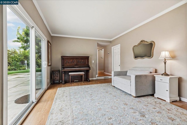 unfurnished living room featuring wood-type flooring and crown molding