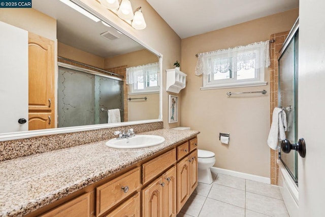 full bathroom with vanity, toilet, tile patterned flooring, and combined bath / shower with glass door