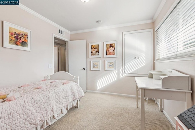 carpeted bedroom featuring crown molding and a closet