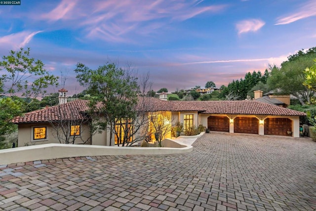 mediterranean / spanish-style home featuring a garage