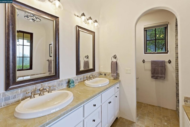 bathroom with vanity and backsplash