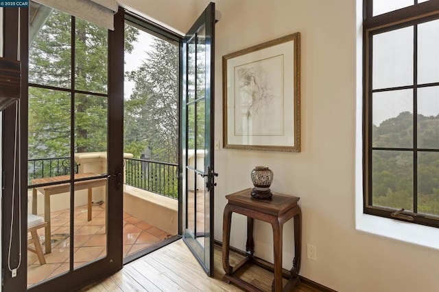 doorway with light wood-type flooring