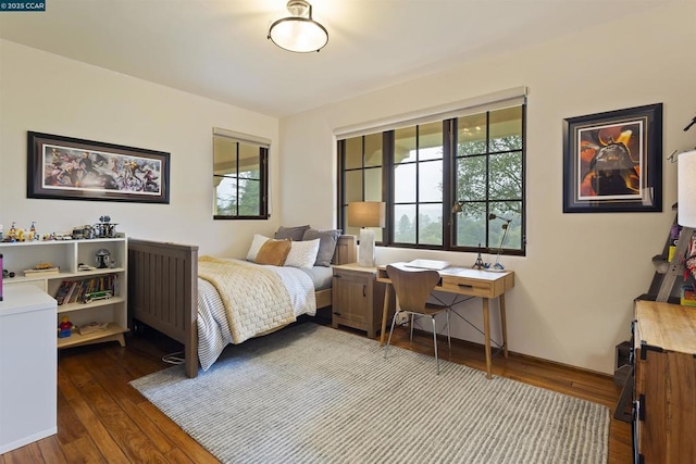 bedroom with hardwood / wood-style flooring