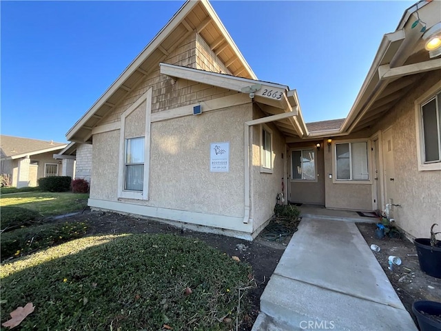 view of side of property with a yard