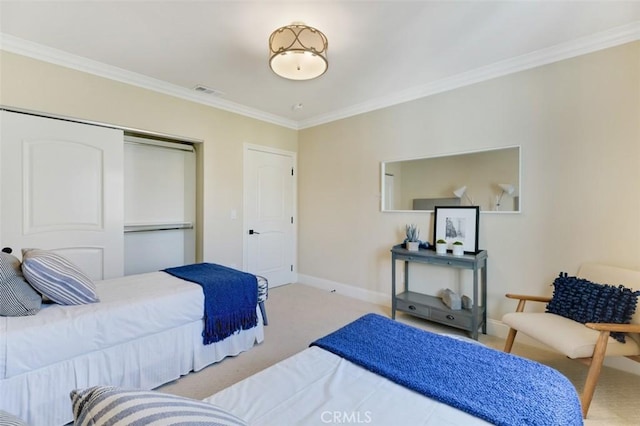 carpeted bedroom featuring ornamental molding and a closet