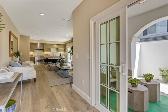 living room with light hardwood / wood-style floors