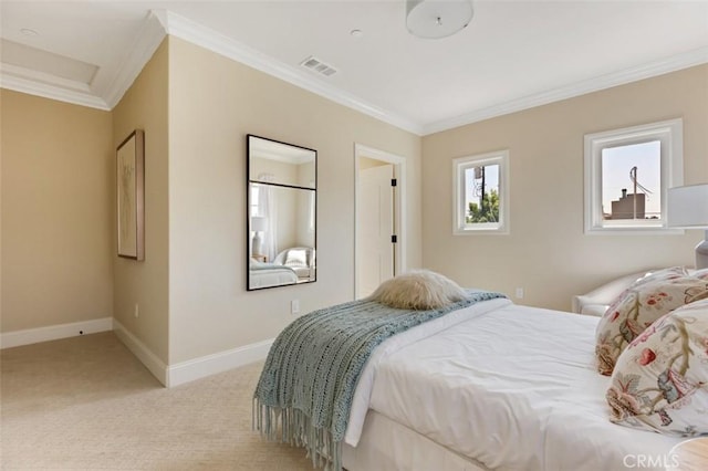 carpeted bedroom with ornamental molding