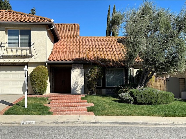 view of front of property featuring a tile roof and stucco siding