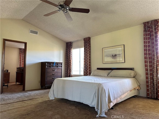 carpeted bedroom featuring lofted ceiling, ceiling fan, visible vents, and a textured ceiling