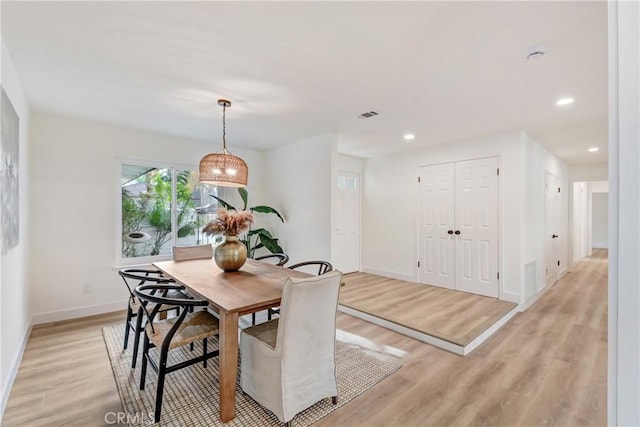 dining room with light hardwood / wood-style flooring