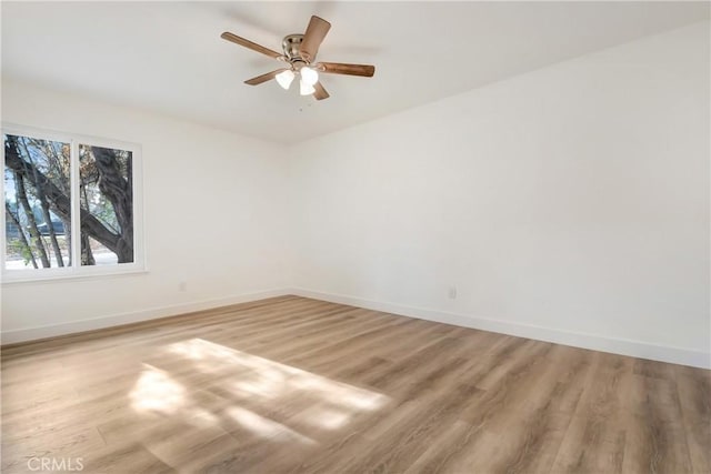 unfurnished room with light hardwood / wood-style floors and ceiling fan