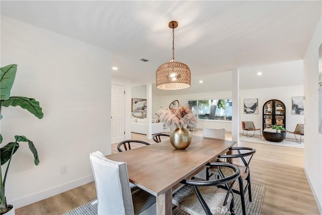 dining area with light hardwood / wood-style flooring