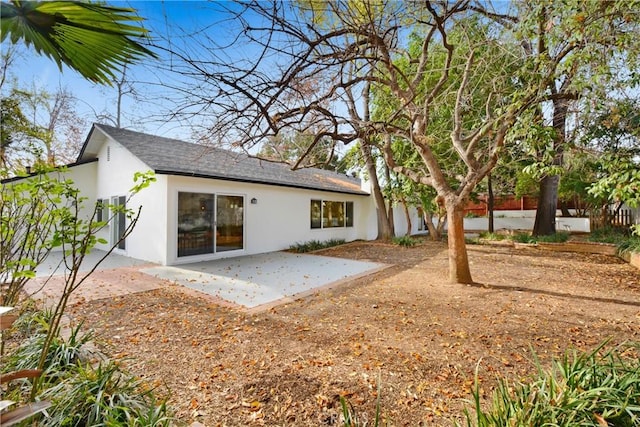 rear view of property featuring a patio