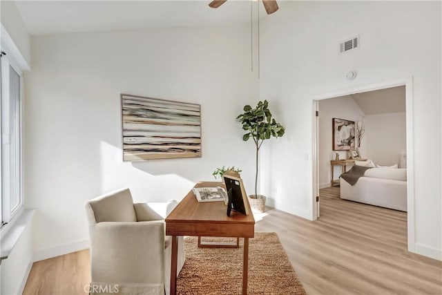 office with ceiling fan and light wood-type flooring