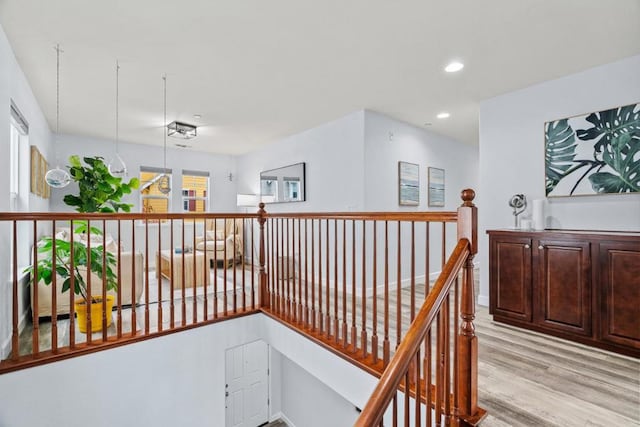 hallway with light hardwood / wood-style flooring