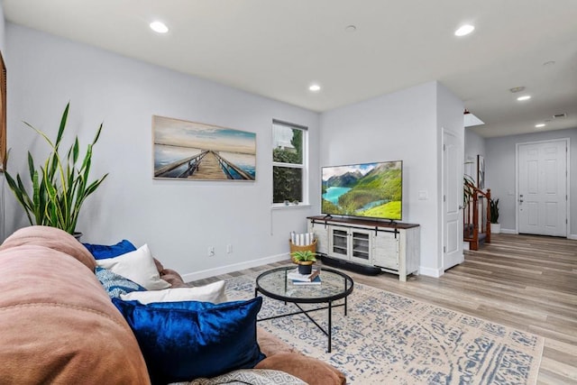 living room with light hardwood / wood-style flooring