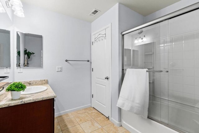 bathroom with vanity and tile patterned floors