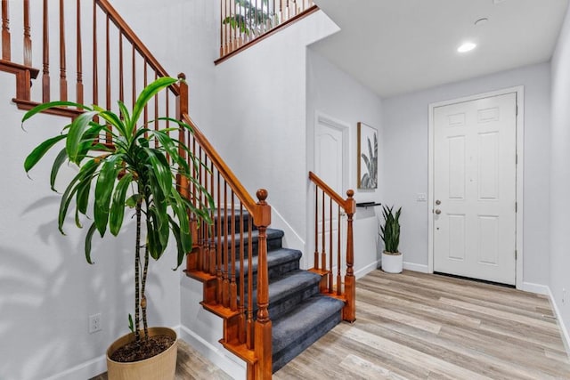 entryway with light hardwood / wood-style floors