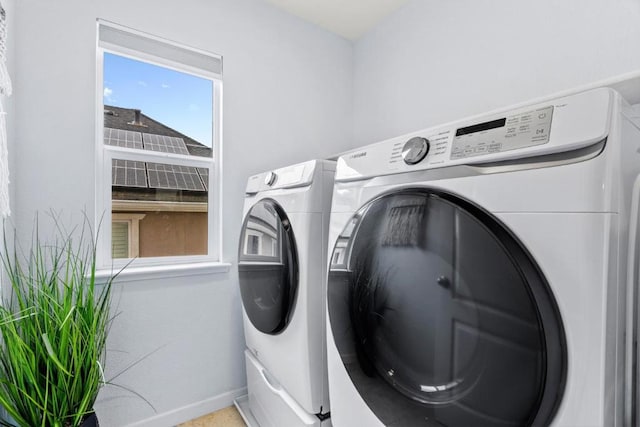 laundry room with washer and dryer