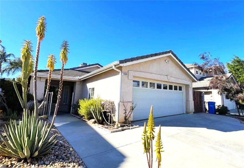 ranch-style house featuring a garage