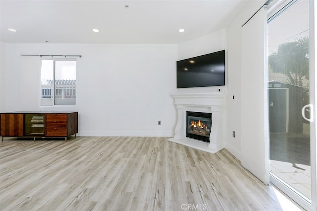 unfurnished living room featuring light hardwood / wood-style floors