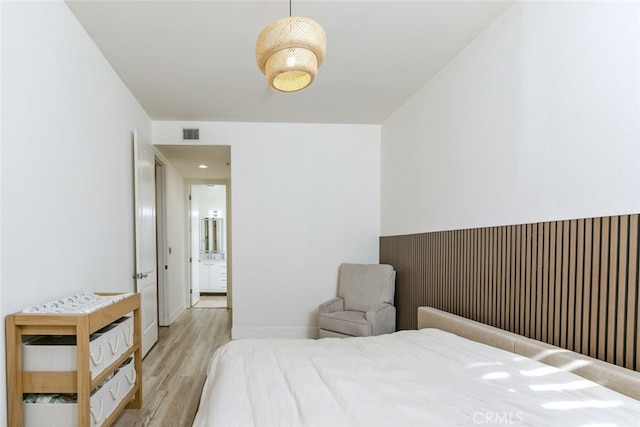 bedroom featuring light wood-type flooring