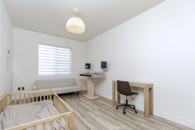 bedroom featuring light hardwood / wood-style floors